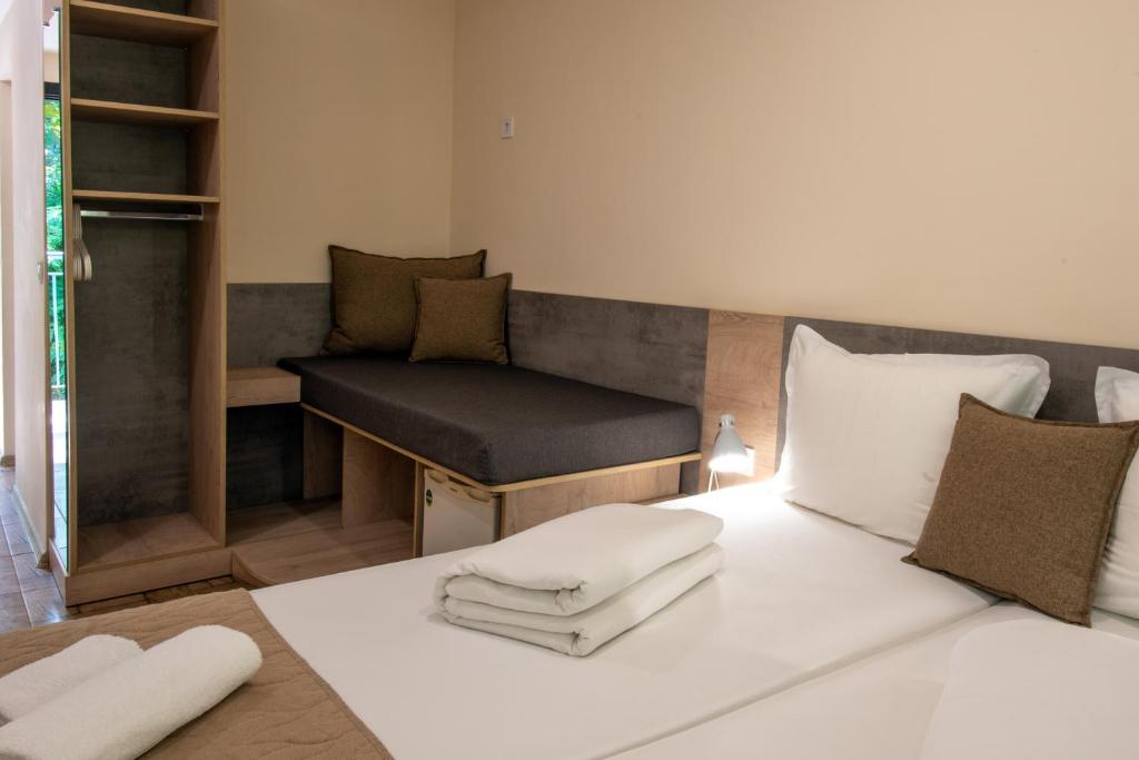 Postel nebo postele na pokoji v ubytování Ariana Hotel