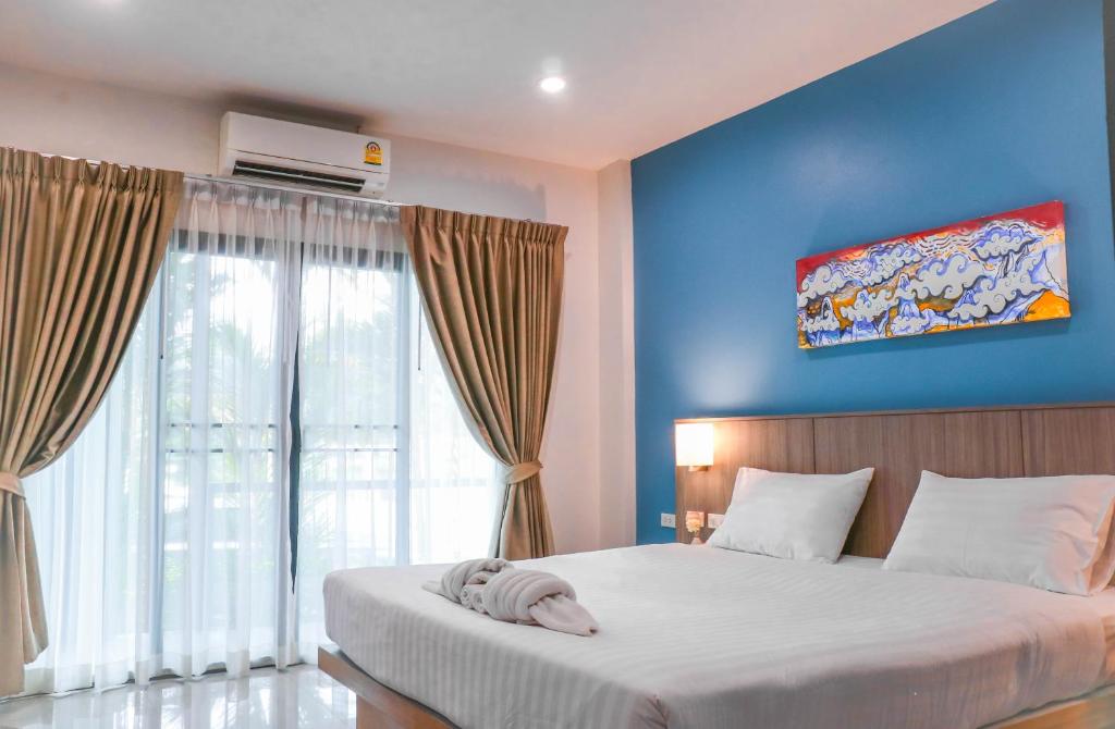 Postel nebo postele na pokoji v ubytování S2 Airport Residence
