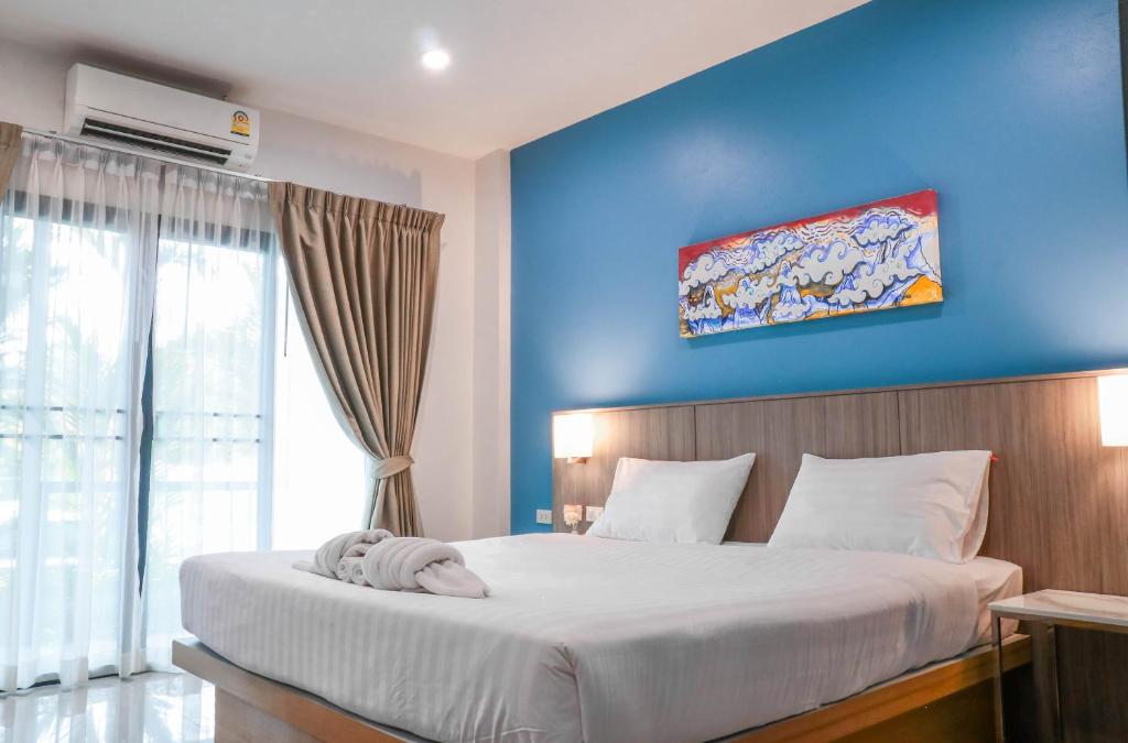 Postel nebo postele na pokoji v ubytování S2 Airport Residence