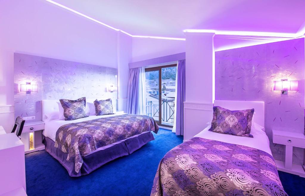 Postel nebo postele na pokoji v ubytování Hotel Princesa Parc Excellence