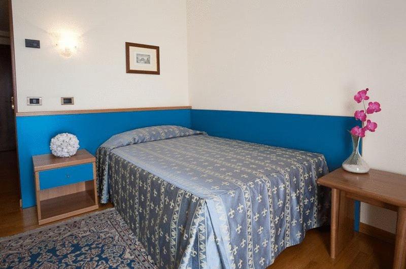 Postel nebo postele na pokoji v ubytování Hotel Spresiano