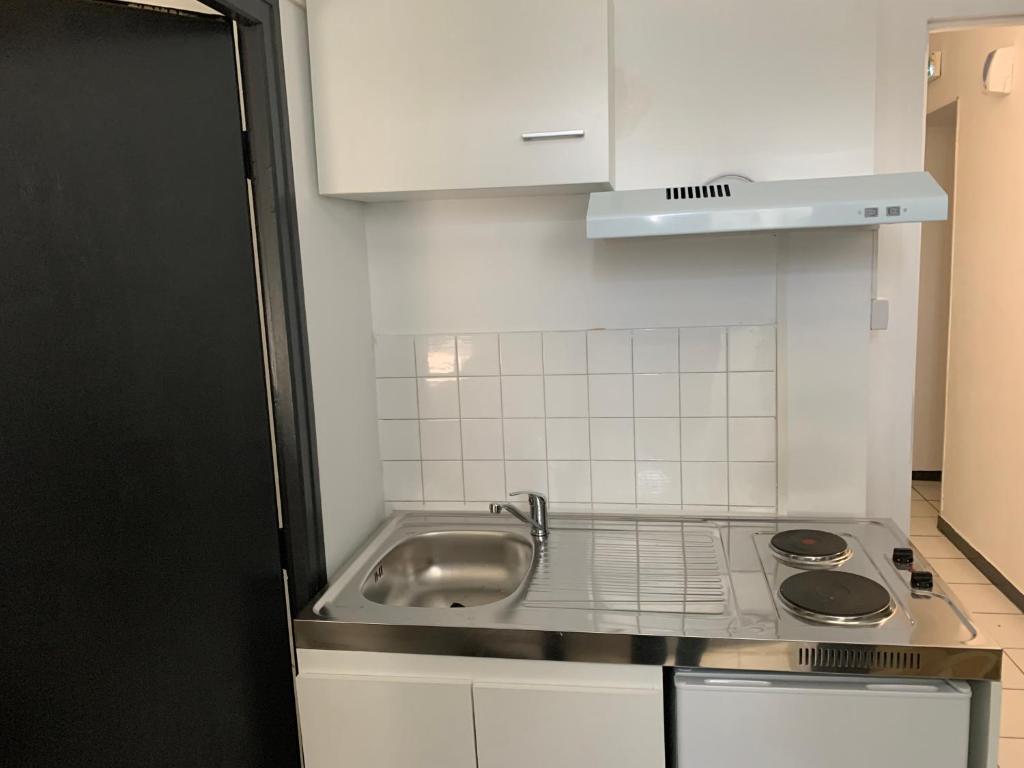 Kuchyň nebo kuchyňský kout v ubytování hôtel Le Cosy