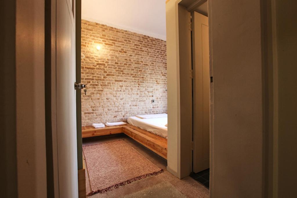 Postel nebo postele na pokoji v ubytování FLANEUR HOSTEL