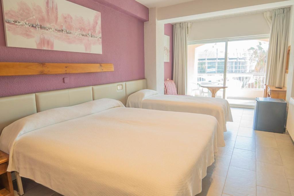 Postel nebo postele na pokoji v ubytování Hotel S'Agoita