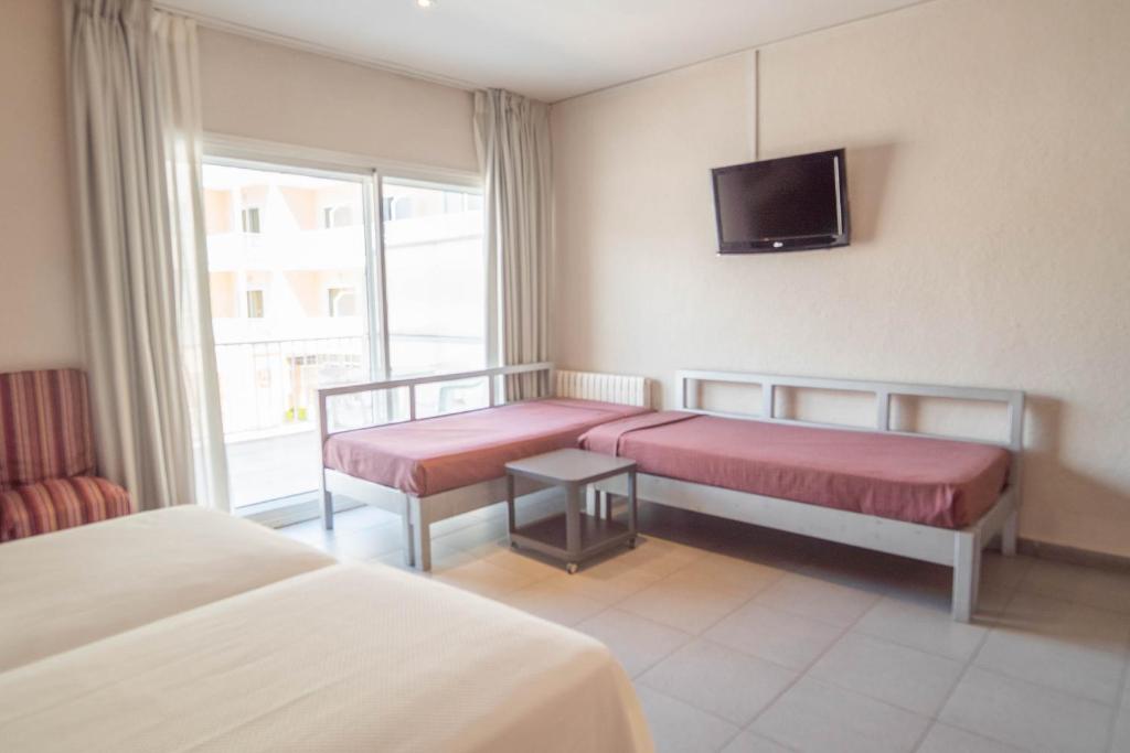 Postel nebo postele na pokoji v ubytování Hotel S'Agoita
