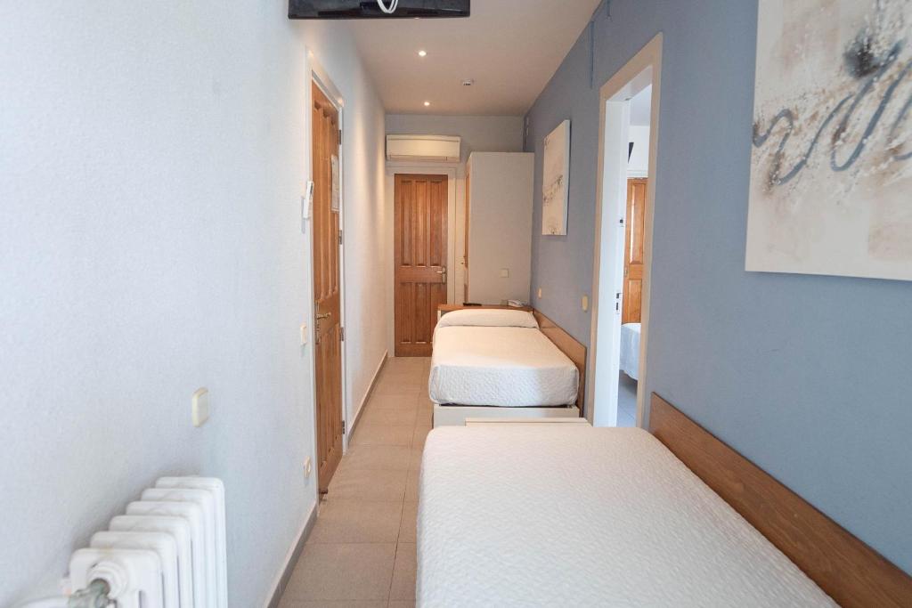 Postel nebo postele na pokoji v ubytování Hotel S'Agoita
