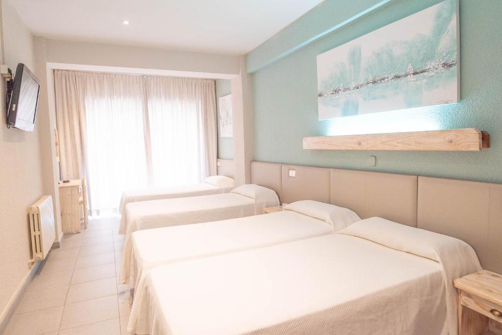 Postel nebo postele na pokoji v ubytování Hotel S'Agoita