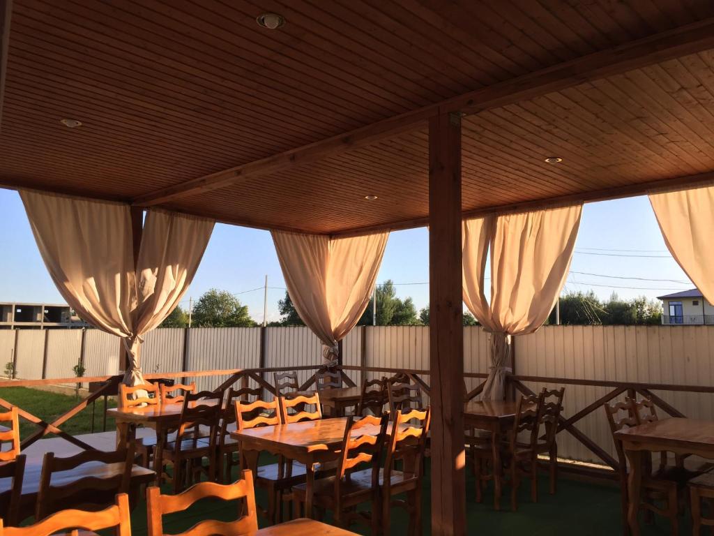 a group of tables and chairs on a patio at Solomon in Alakhadzi