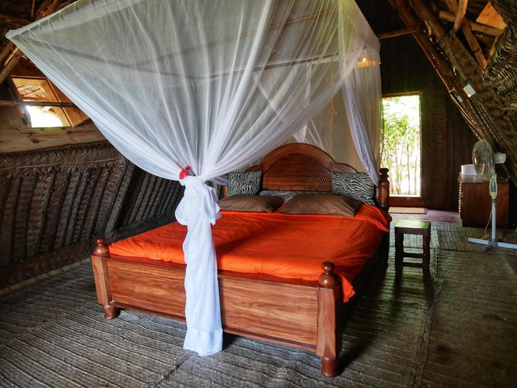 Postel nebo postele na pokoji v ubytování COCO REEF ECOLODGE