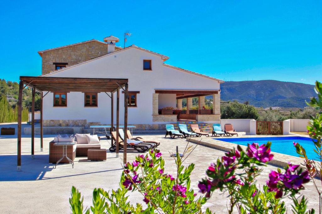 a villa with a swimming pool and a house at Finca Argudo - private pool villa in Moraira in Moraira