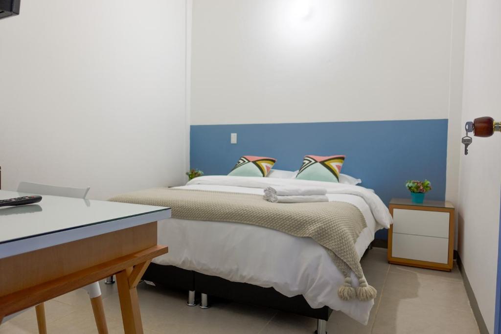Rúm í herbergi á Hotel Azulado Jericó
