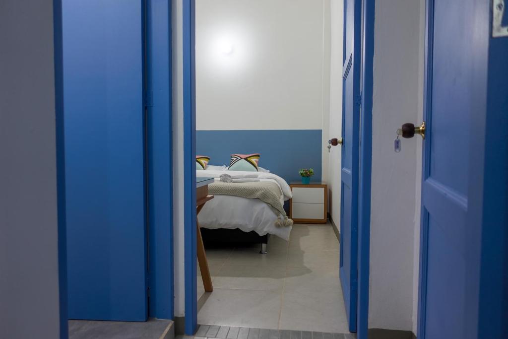 Rúm í herbergi á Hotel Azulado Jericó