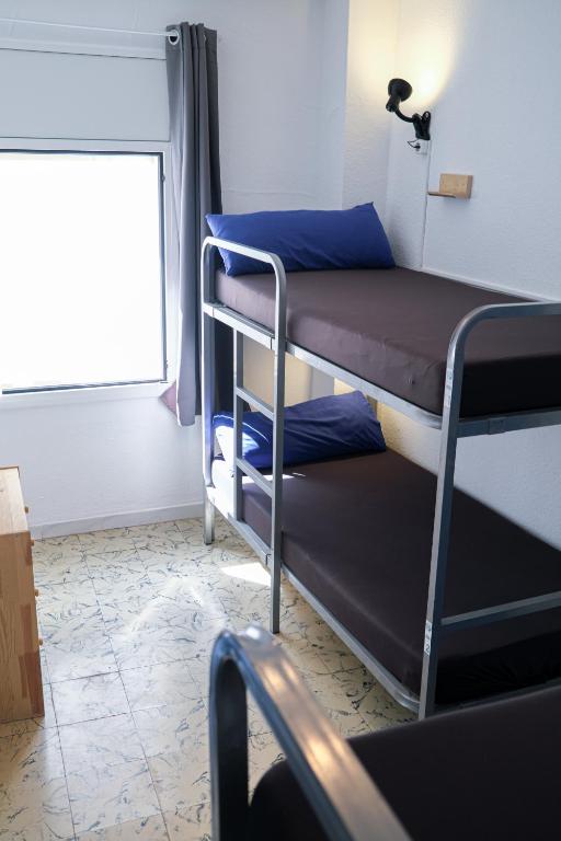 Postel nebo postele na pokoji v ubytování Mana Mana Youth Hostel