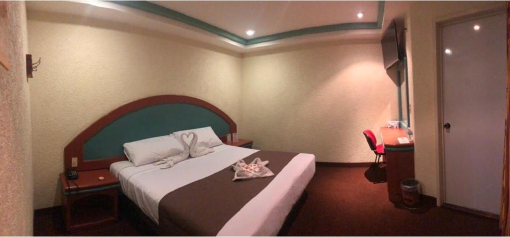 Postel nebo postele na pokoji v ubytování HOTEL ORION
