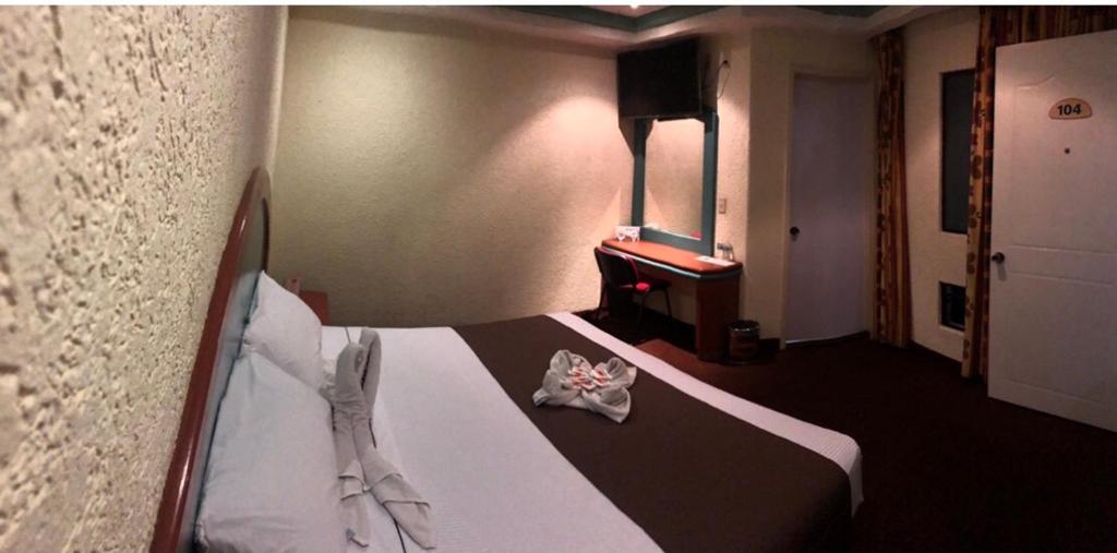 Postel nebo postele na pokoji v ubytování HOTEL ORION