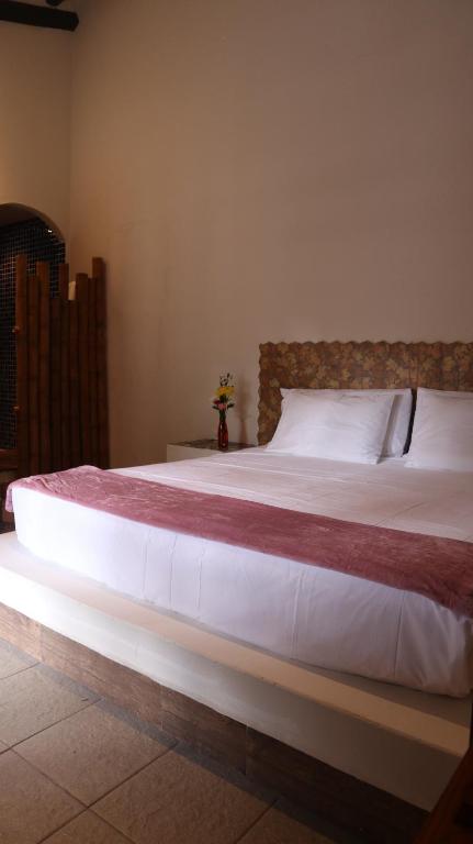Postel nebo postele na pokoji v ubytování Casa Grimaldo
