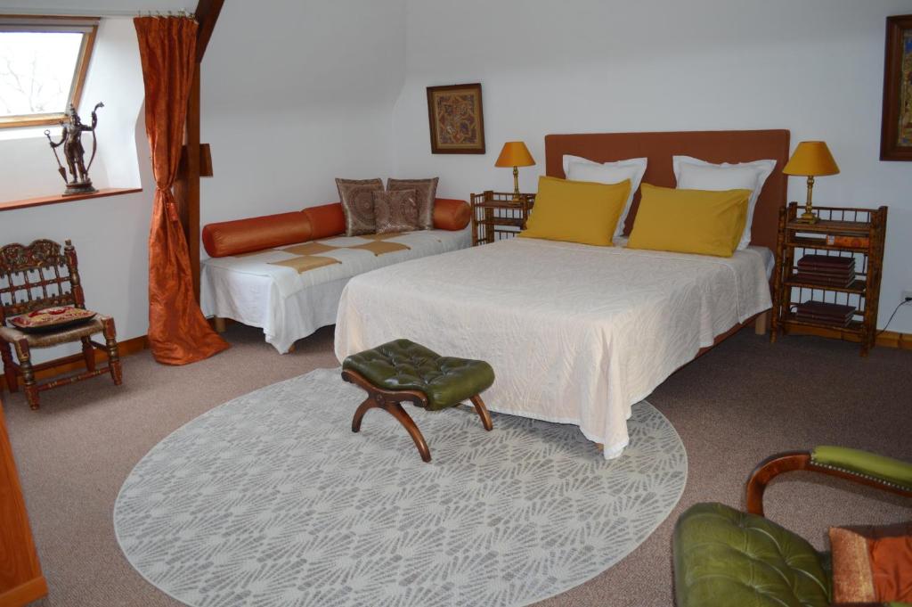 Postel nebo postele na pokoji v ubytování Manoir de Beaupré