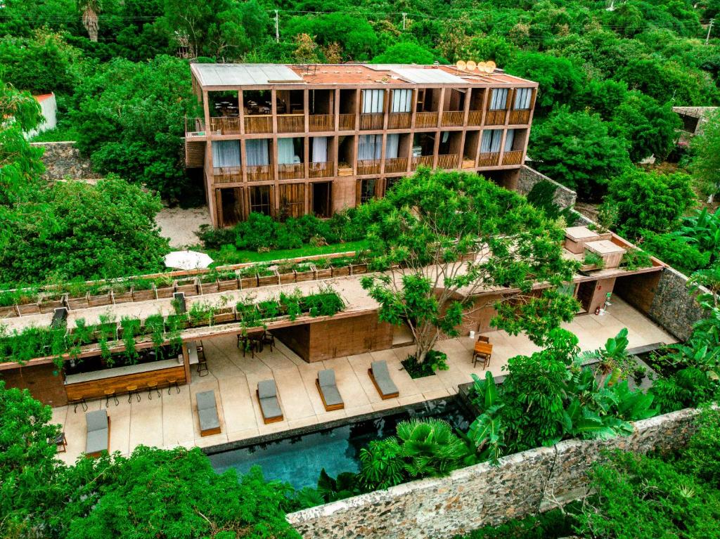 an aerial view of a building in a forest at Casa de Agua in Tepoztlán