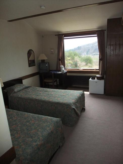 Postel nebo postele na pokoji v ubytování Guesthouse Sakuya