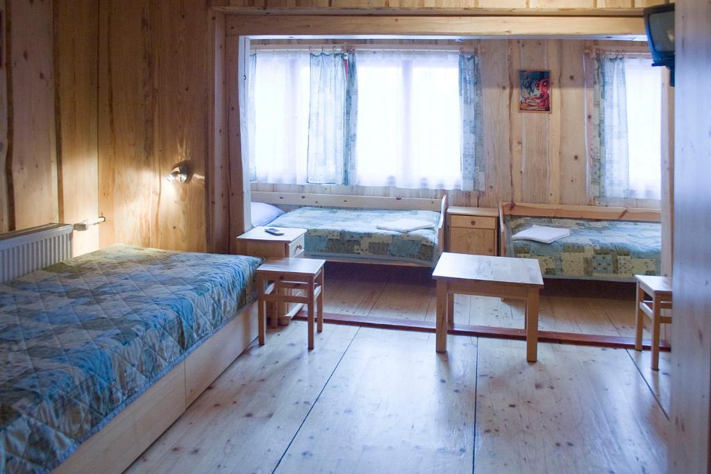 Postel nebo postele na pokoji v ubytování Penzión Javorina