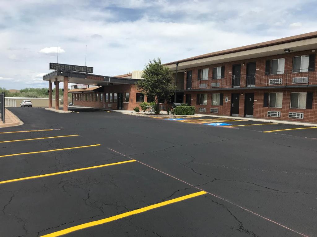 an empty parking lot in front of a building at Econo Lodge Salina Scenic Route 89 & I-70 in Salina