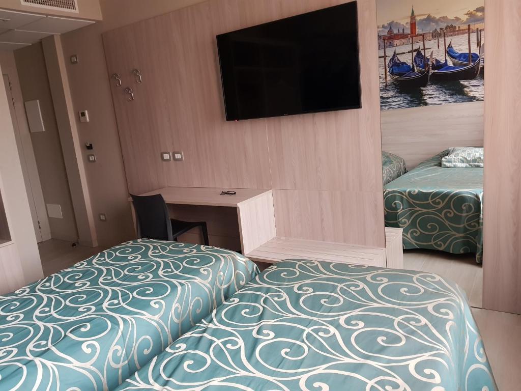 Postel nebo postele na pokoji v ubytování Hotel Altieri