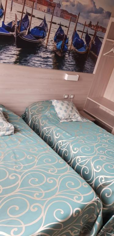 Postel nebo postele na pokoji v ubytování Hotel Altieri