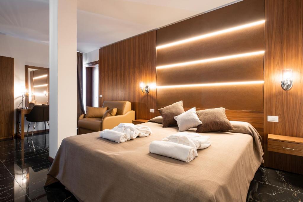 Hotel Mare tesisinde bir odada yatak veya yataklar