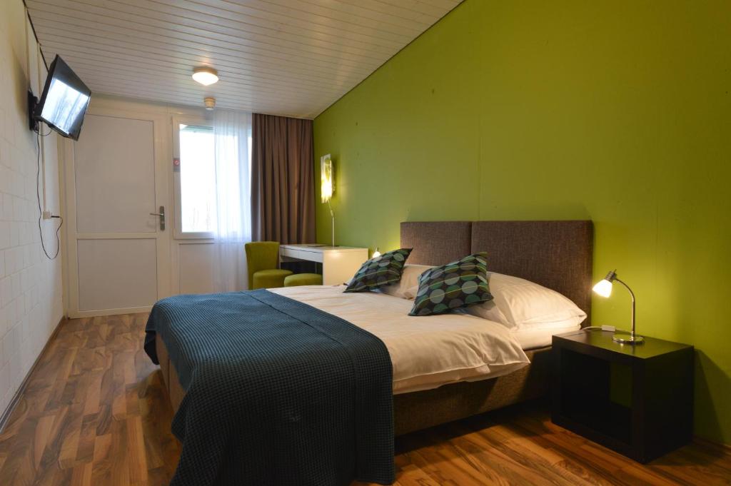 Postel nebo postele na pokoji v ubytování Hotel Bodensee-Arena