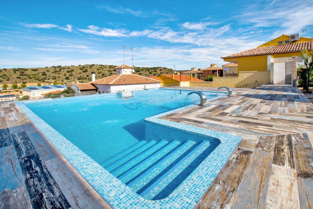 a swimming pool on top of a house at Casa Rural La Torca Ruidera in Ruidera