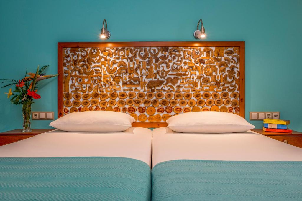 Postel nebo postele na pokoji v ubytování Aris Boutique Hotel