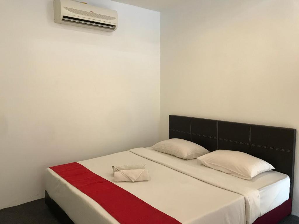 En eller flere senger på et rom på HL HOTEL Kota Bharu