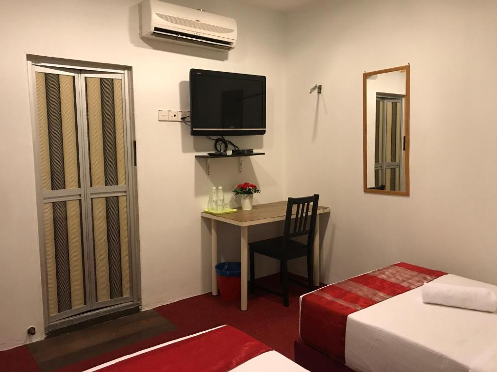 Postel nebo postele na pokoji v ubytování HL HOTEL Kota Bharu