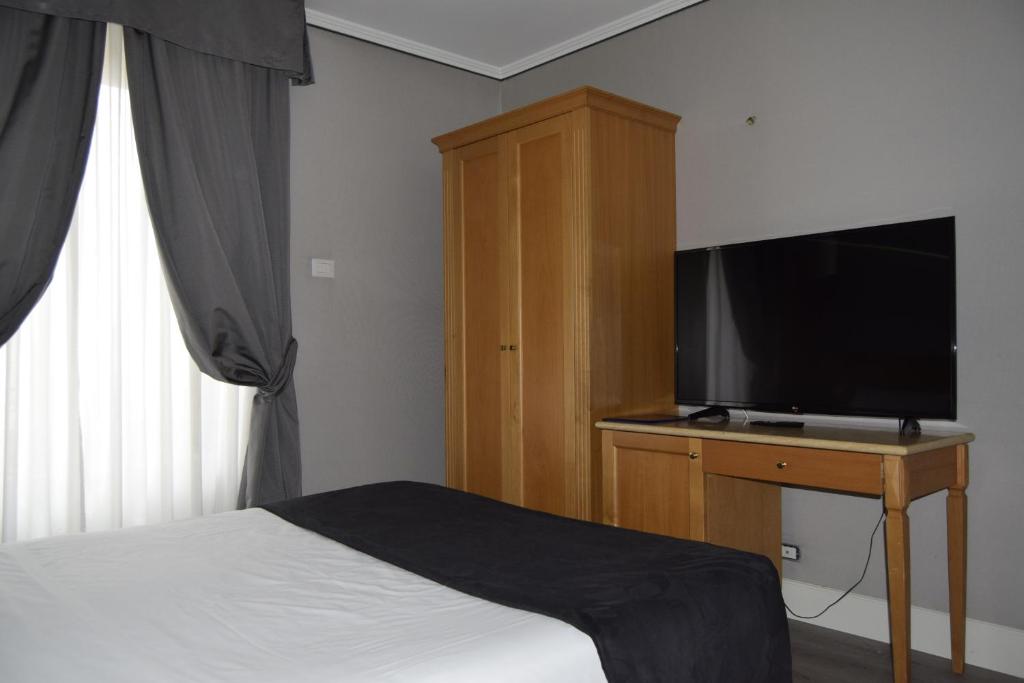 TV a/nebo společenská místnost v ubytování Hotel dei Quiriti