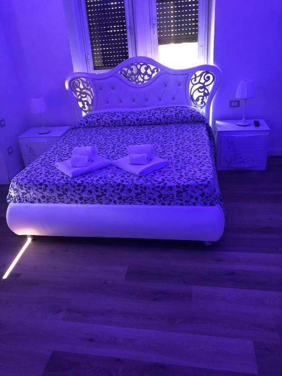Łóżko lub łóżka w pokoju w obiekcie Messina41 Hotel