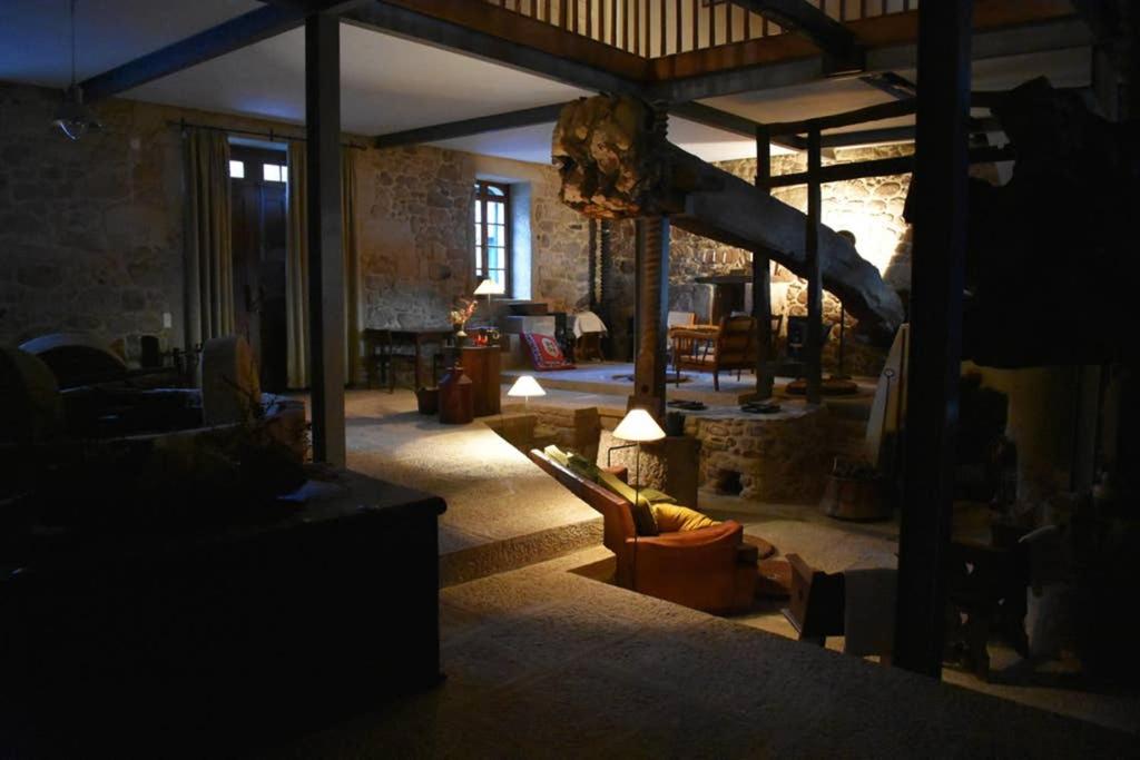 a living room with a couch and a slide at Casa do Lagar de Medelim in Medelim