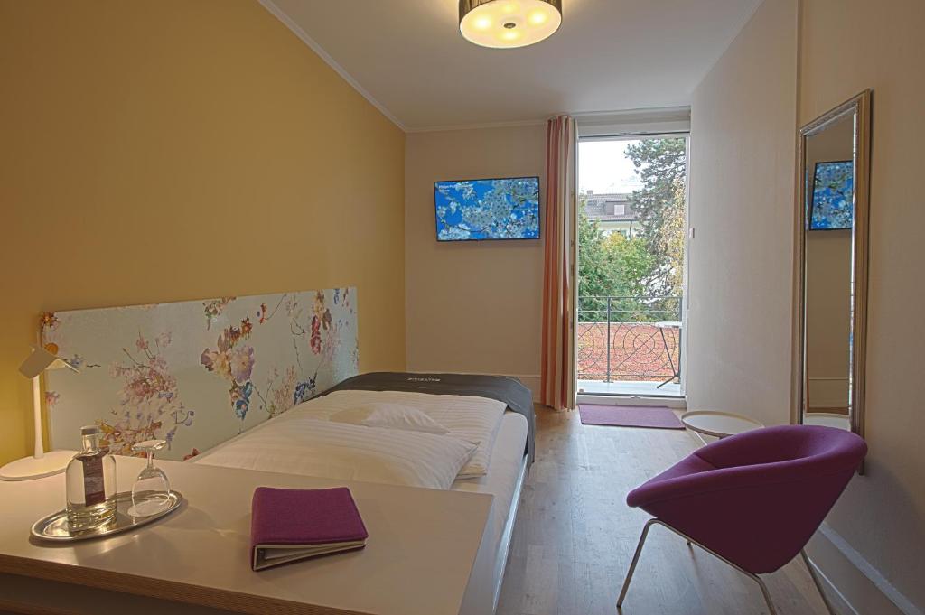 Postel nebo postele na pokoji v ubytování Boutique Hotel Bellevue