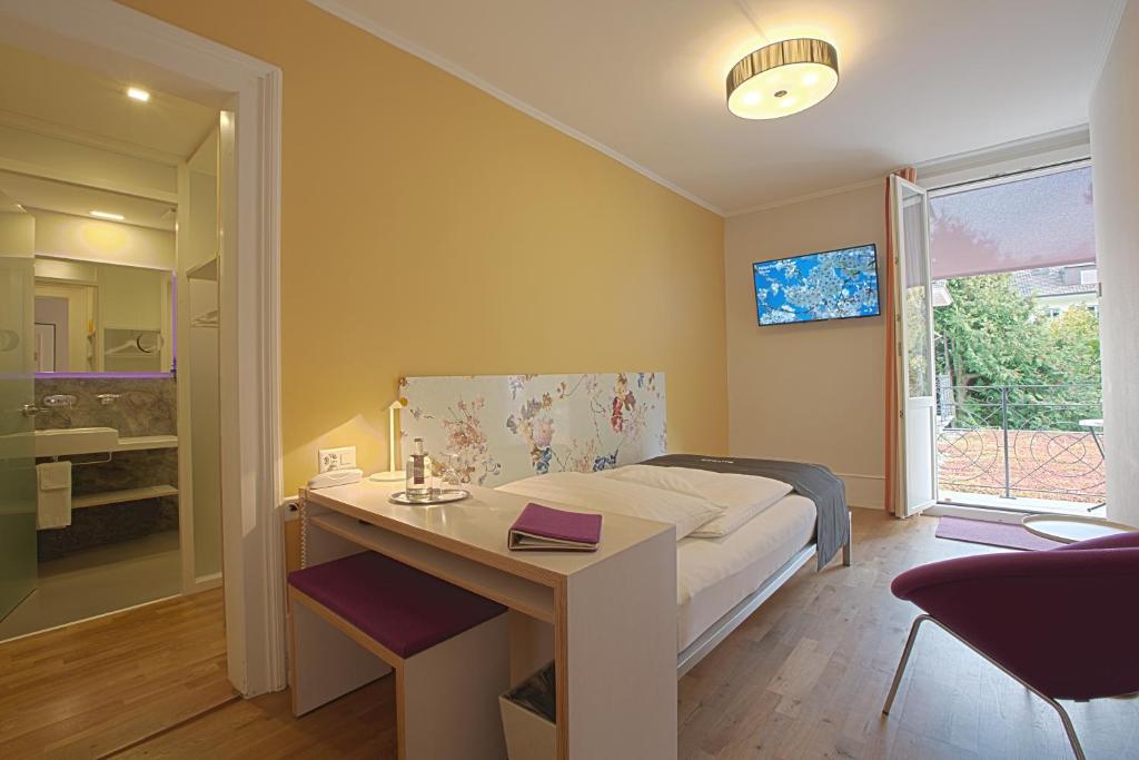 TV a/nebo společenská místnost v ubytování Boutique Hotel Bellevue