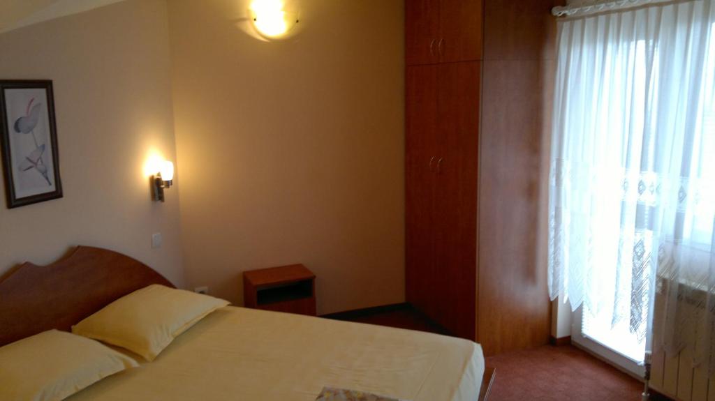 Postel nebo postele na pokoji v ubytování Classic Hotel