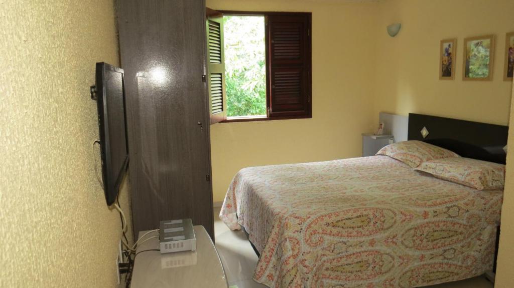 En eller flere senge i et værelse på Casa da Socorro - Serra de Guaramiranga