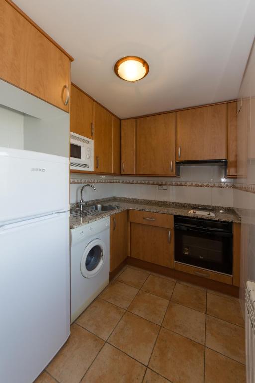 Kuchyň nebo kuchyňský kout v ubytování Casa Soltero Apartamentos