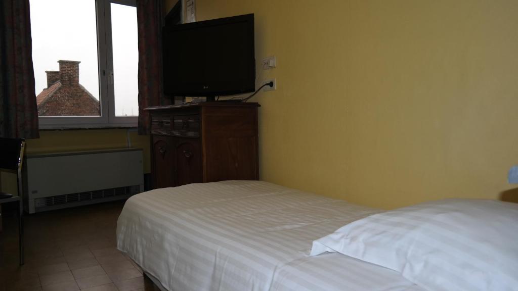 Postel nebo postele na pokoji v ubytování De Bonte Os Hotel & Tower