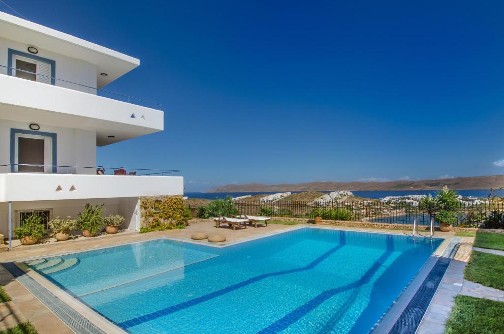 a villa with a swimming pool with a view at Sounio Villa in Sounio