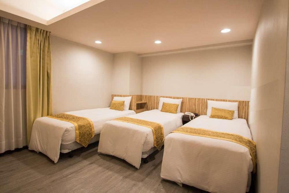 Postel nebo postele na pokoji v ubytování City Hotel