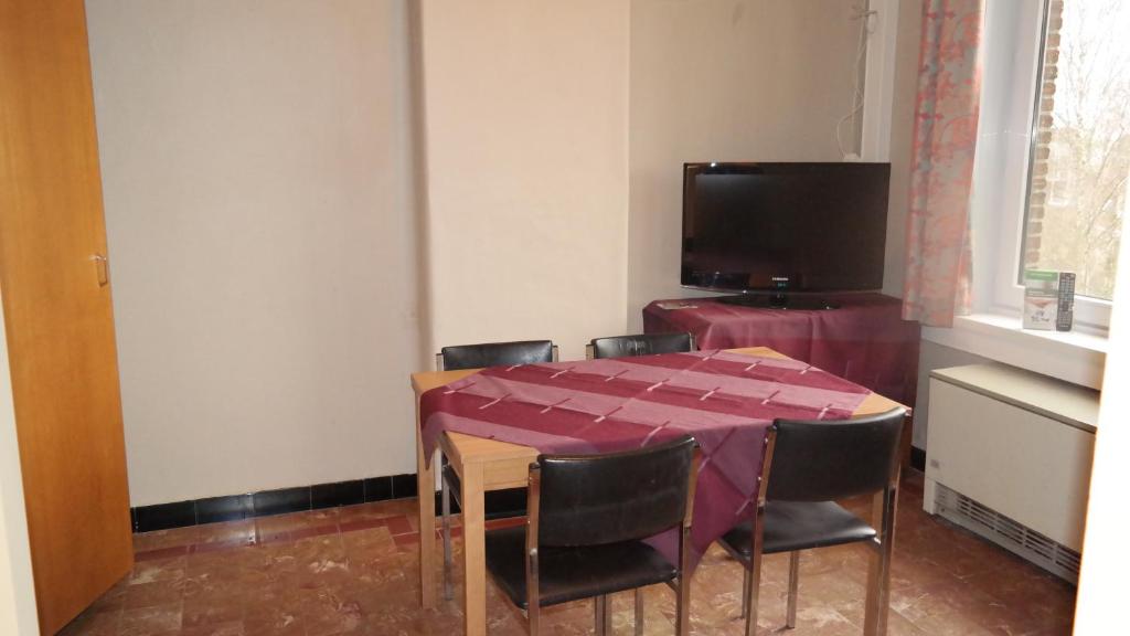 TV a/nebo společenská místnost v ubytování De Bonte Os Hotel & Tower