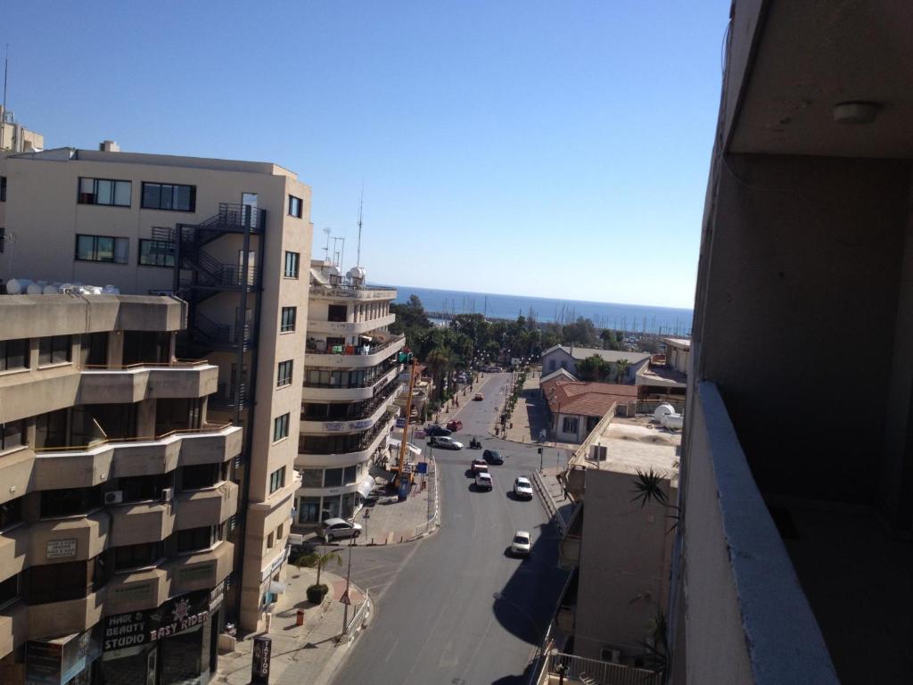 a view of a street in a city with buildings at Francis Apartments in Larnaca