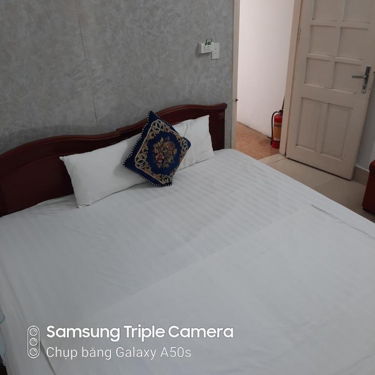 Postel nebo postele na pokoji v ubytování Hanoi Carina Hotel