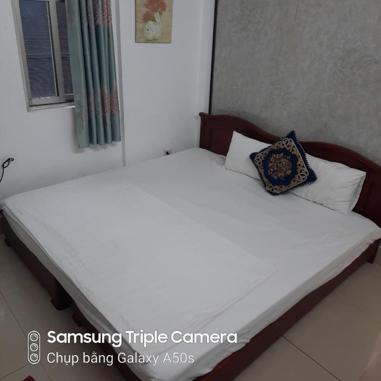 Postel nebo postele na pokoji v ubytování Hanoi Carina Hotel