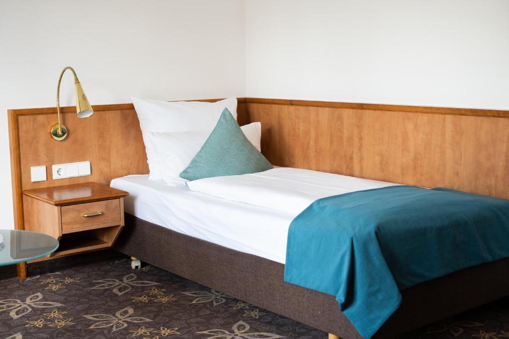 Postel nebo postele na pokoji v ubytování Hotel Württemberger Hof