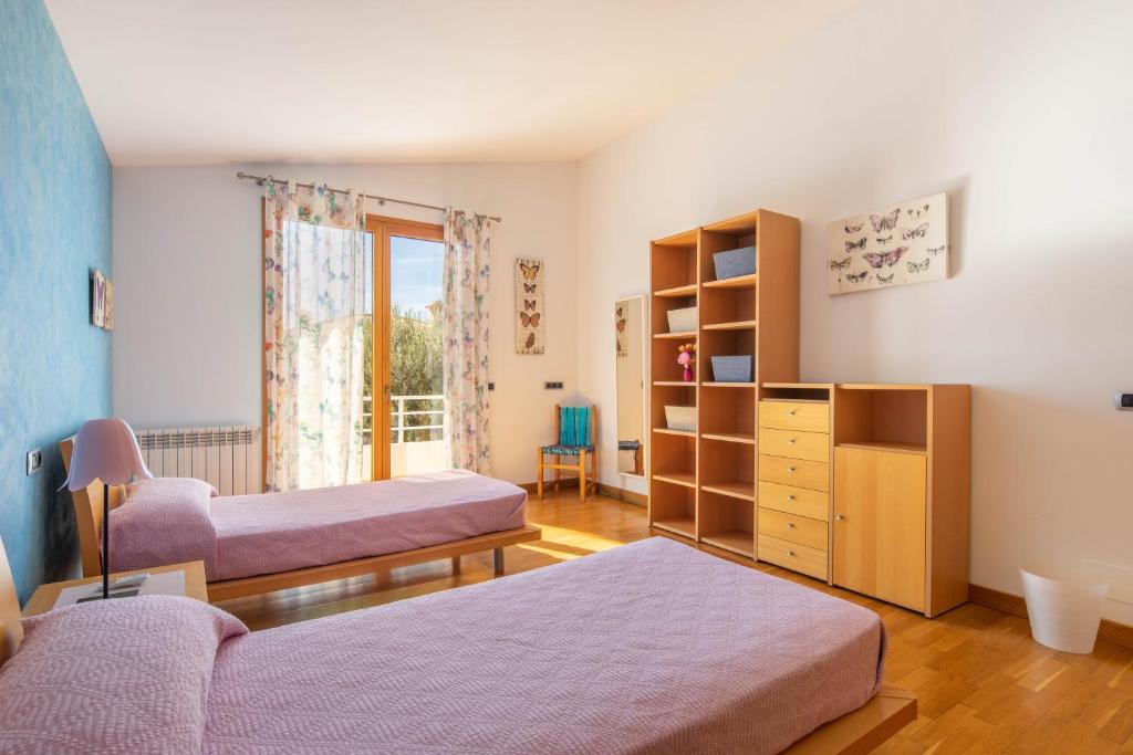 Posteľ alebo postele v izbe v ubytovaní Villa Can Monxo By SunVillas Mallorca